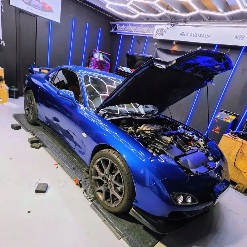 Blue Mazda RX-7 with bonnet up at Euro Chiptuning Solutions